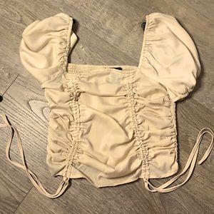 The top is from forever 21. It is an a size small. The color is light brown.